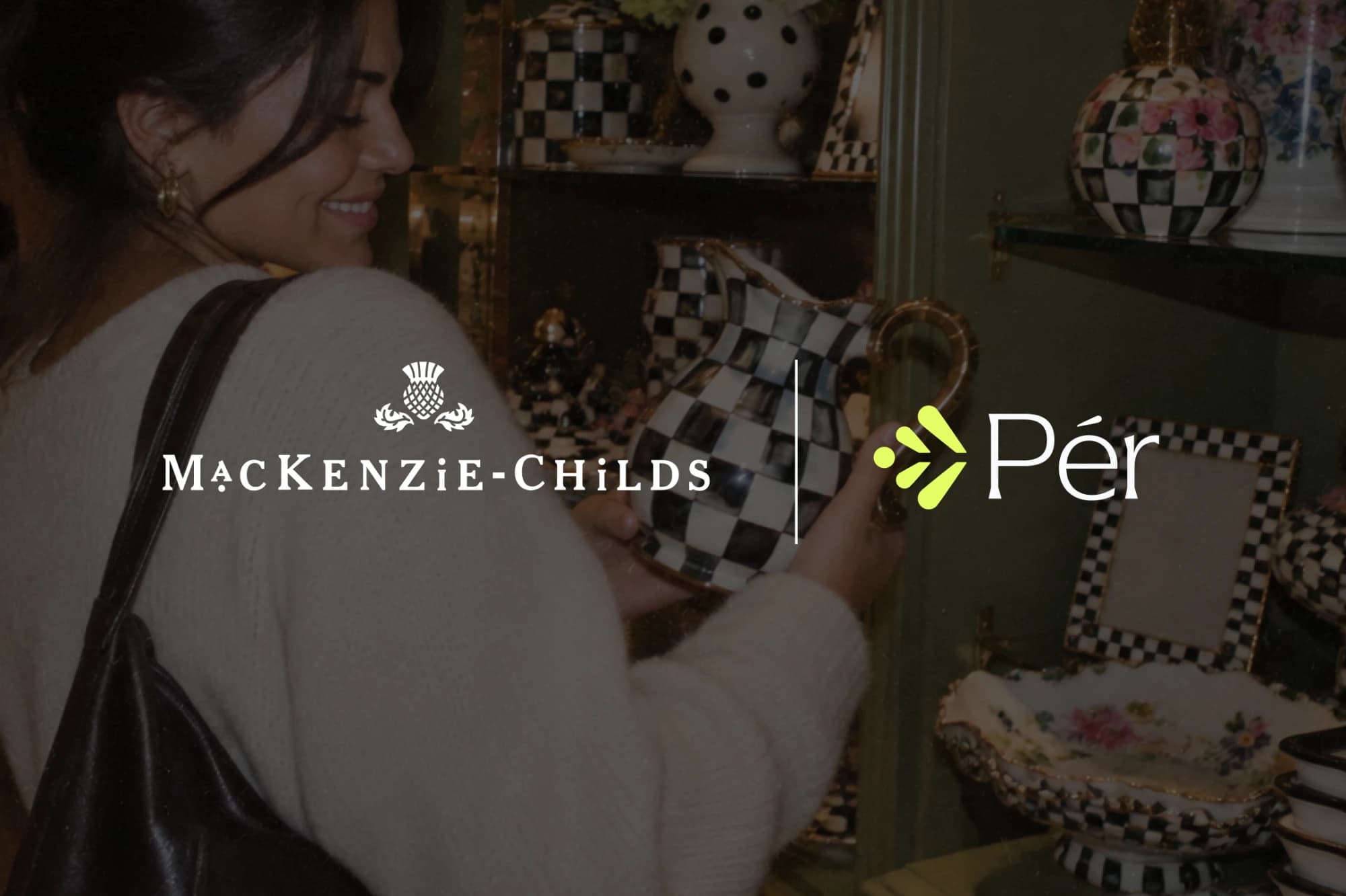 A shopper browses MacKenzie-Childs checked ceramics in a store, overlaid with the MacKenzie-Childs and Pér logos.